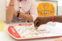 Two people playing scrabble