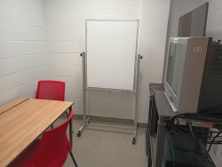 Viewing room with desk television and whiteboard