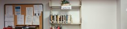 Shelf of books on hold