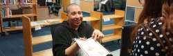 student helping patron