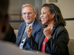 Laurie W. Newell at a table with Bryan Murdock