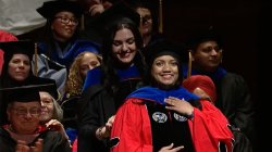 Dr. Debasmita Basu being hooded by Dr. Nicole Panorkou