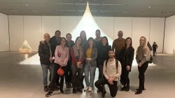 group in front of snow pyramid