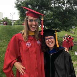 graduate student at graduation with their mentor