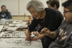 Students and Faculty writing Japanese Calligraphy