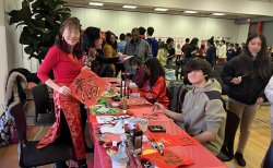 Students writing calligraphy