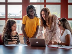 Gladys Riccardi, Janica Pierre and Adriana Morsella, among the first students in the new BA in Language, Business and Culture, meet with the program’s director, Enza Antenos.