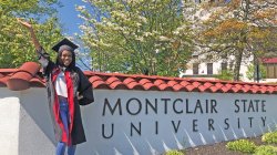 student in front of main entrance