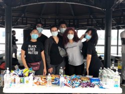 volunteers posed at hydration/food station at protest
