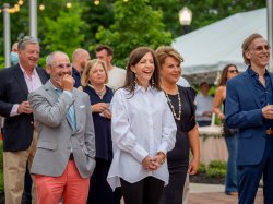 New Jersey First Lady Tammy Snyder Murphy (center) and guests react to Gov. Phil Murphy’s remarks.
