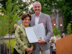 New Jersey Governor Phil Murphy presents a proclamation to Susan A. Cole of Montclair State University