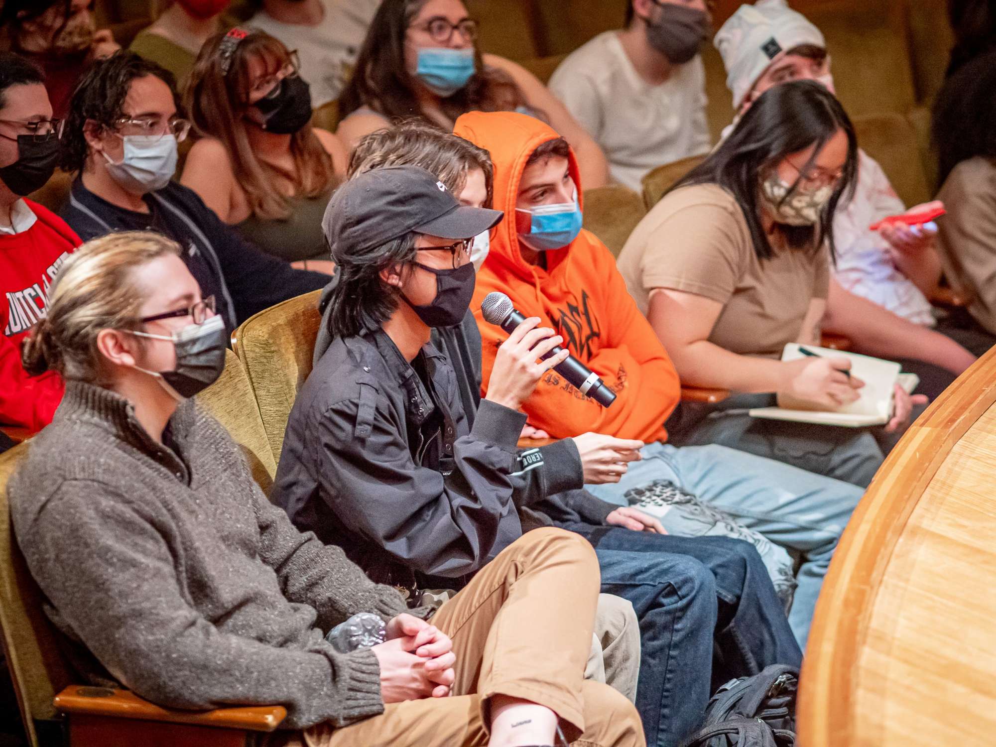 Student in audience with microphone asking question