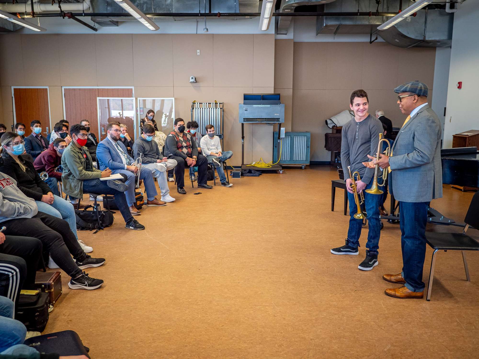 Marsalis speaking to students at a brass master class