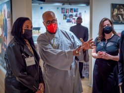 from left to right: Brenda Coleman-Caldwell, artist Ajamu Kojo, and Megan C. Austin