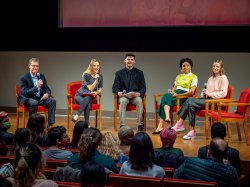 Joseph Brennan on stage with student participants Kaya Maciak, Jack Barteck, Sienna Grant Mitsak, and Jennifer Burlage