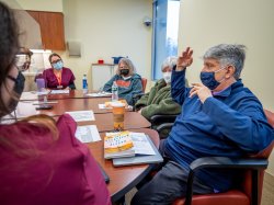 Members of the Aphasia Book Club seated around a table
