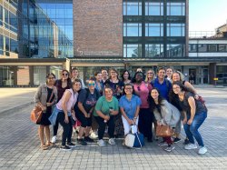 Group of Montclair State students and faculty posing and smiling