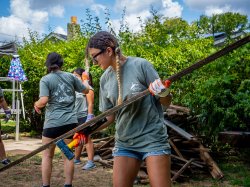Student volunteers clearing debris