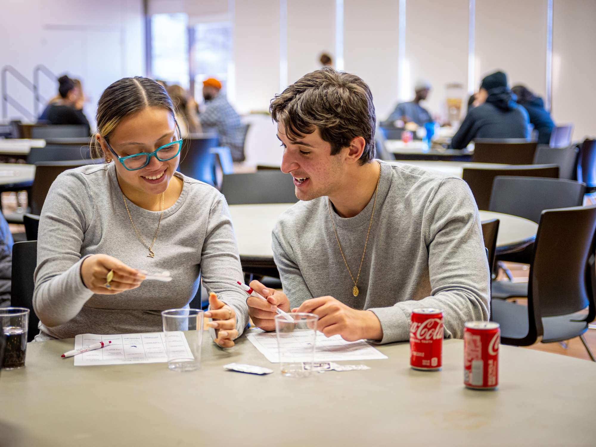 two students seated side-by-side