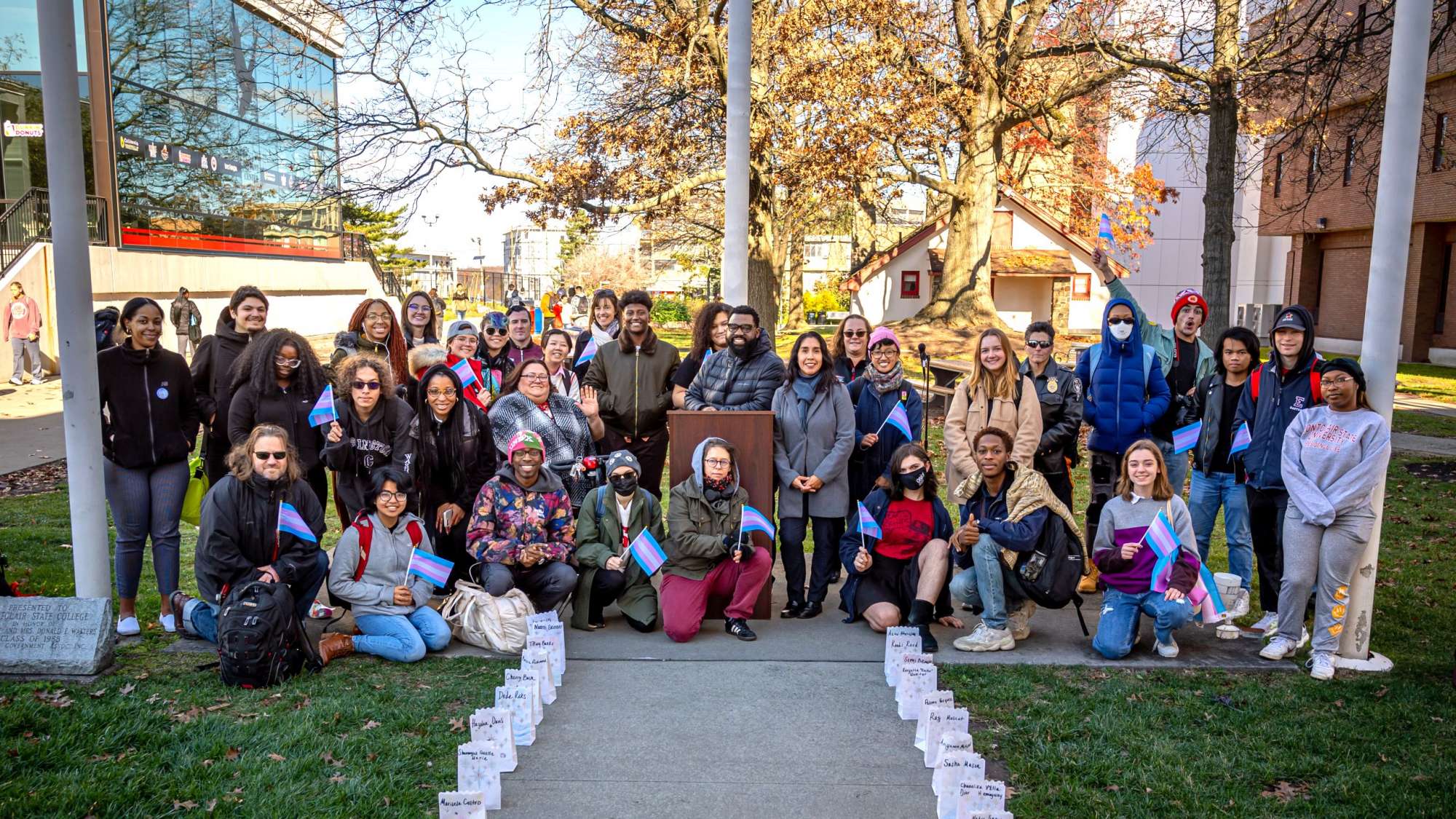 A group of transgender people and allies held a flag-raising ceremony and vigil for Transgender Awareness Week.