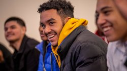 Young men smiling.
