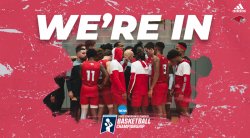 A basketball team huddles.