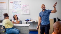 Workshop leader teaches in a classroom.
