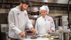 Montclair State University President Jonathan Koppell cooking at Sam's Diner
