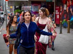A group of students walk on a NYC street.