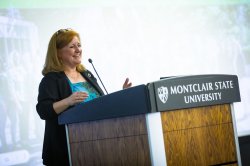 Amy Tuininga standing at podium