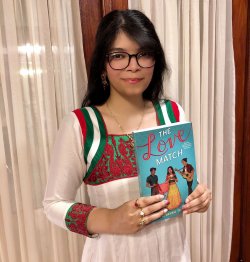 Priyanka Taslim holding her book Love Match.