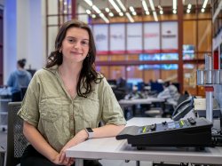 A student poses in Montclair’s News Lab.