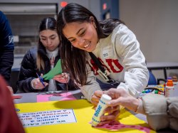 A student makes a poster.