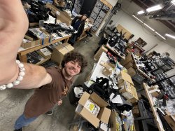 Students in a camera gear warehouse.