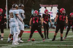 Red Hawks offensive lineman Cameron Siebert stands midfield.