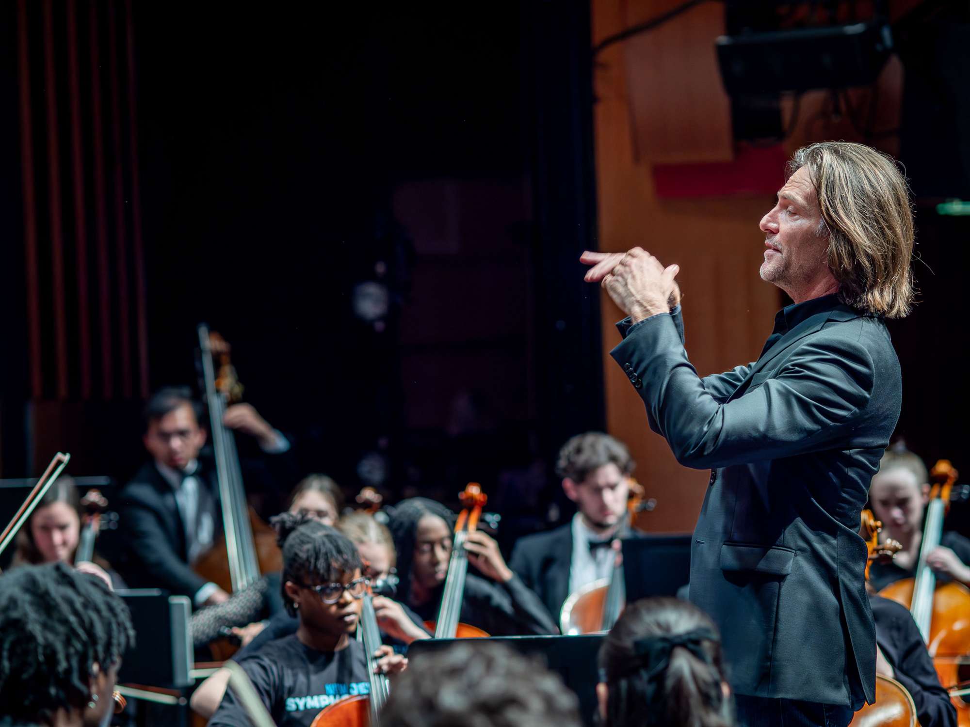 A man conducts an orchestra