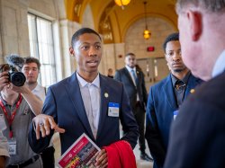 A student talks to a state senator.