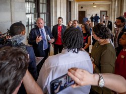 A state senator talks to a group of students, faculty and staff.