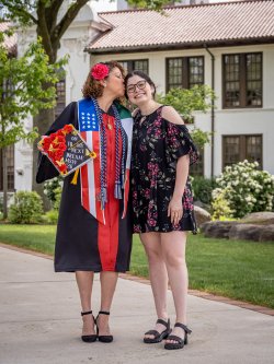 Iliana Woodhull kisses her daughter Angel Bernales on the temple on the Montclair campus.