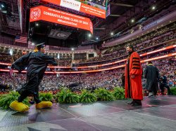 Joseph Lepinski dances across the Commencement stage.