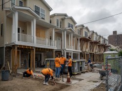 火狐体育 volunteers work together on a Habitat for Humanity home construction site in Paterson, NJ, as part of the 9/11 Day of Service and Remembrance.