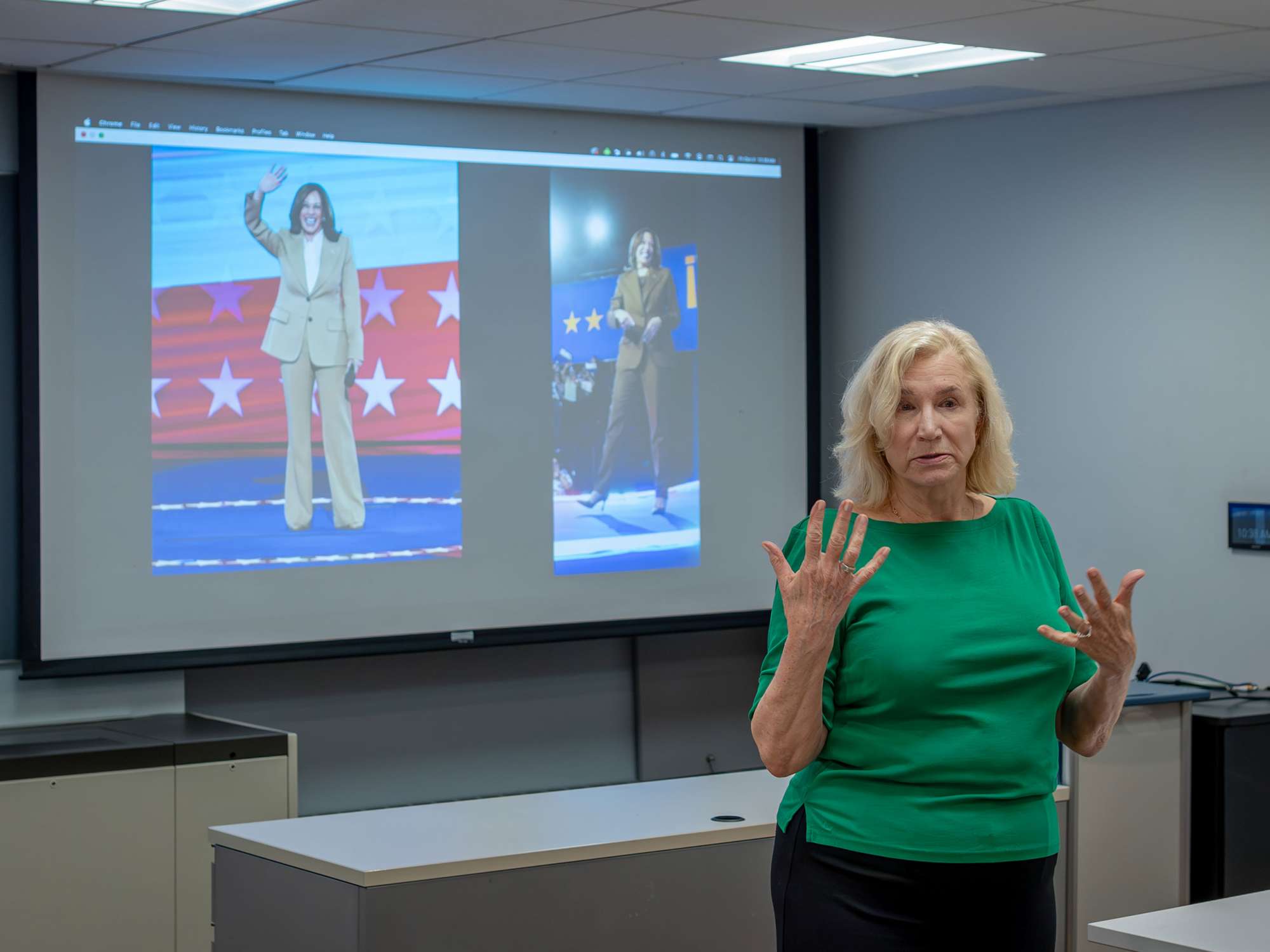 ProfessorAbby Lillethundisplays photos of Kamala Harris in two pantsuits.