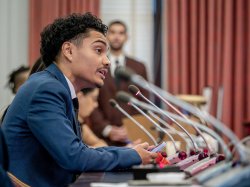 A student speaks to a committee at the New Jersey State Capitol.