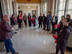 Montclair State University and Bloomfield College students speak with an elected official at the New Jersey State Capitol.