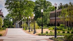 Photo of path near Partridge Hall on a sunny day.