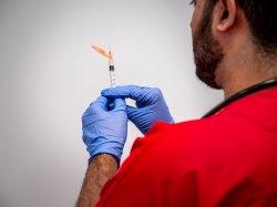 Close up photograph of male nursing student in the simulation lab.