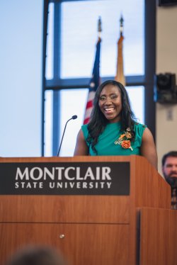 Montclair School of Nursing faculty member standing at a podium.
