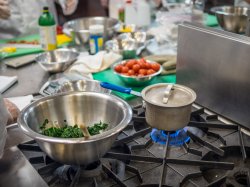 Photo of pot on stove in cooking lab.