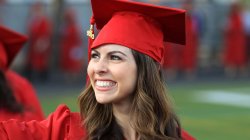 Master's candidate in red cap and gown