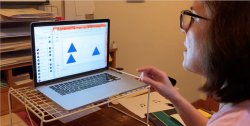Professor Eileen Fernandez teaches students how to make the Sierpinski Triangle in MTHM 507, Geometry for Middle Grade Math Teachers